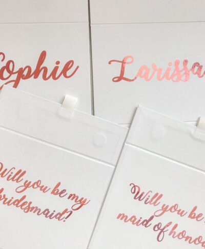bridesmaid and maid of honour boxes with pink writing