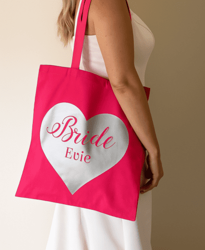 Personalised heart canvas bag in pink with silver lettering for bride