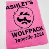 Bright pink personalised stag do t-shirt with bold black “Last Night in the Wolfpack” design, custom groom’s name, location, and date.