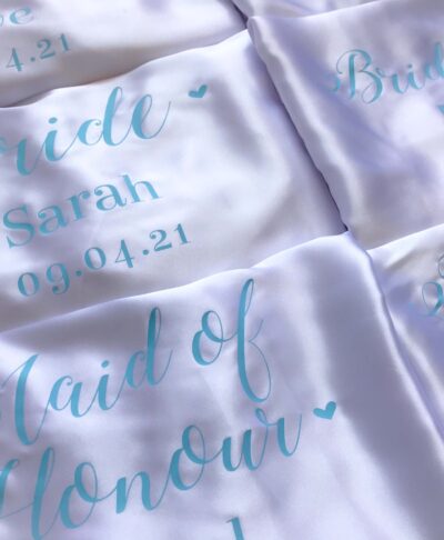 wedding role satin robe with blue text