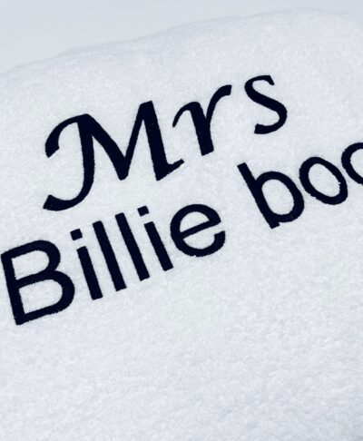 White terry towelling robe with custom black embroidery showing 'Mrs' in script above 'Billie boo' in a bold font. Ideal personalised gift for a bride or wife.