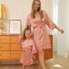 Mother and daughter wearing matching dusty rose pink satin lace robes – Children’s Personalised Satin Lace Robe from The Personalised Wedding Room