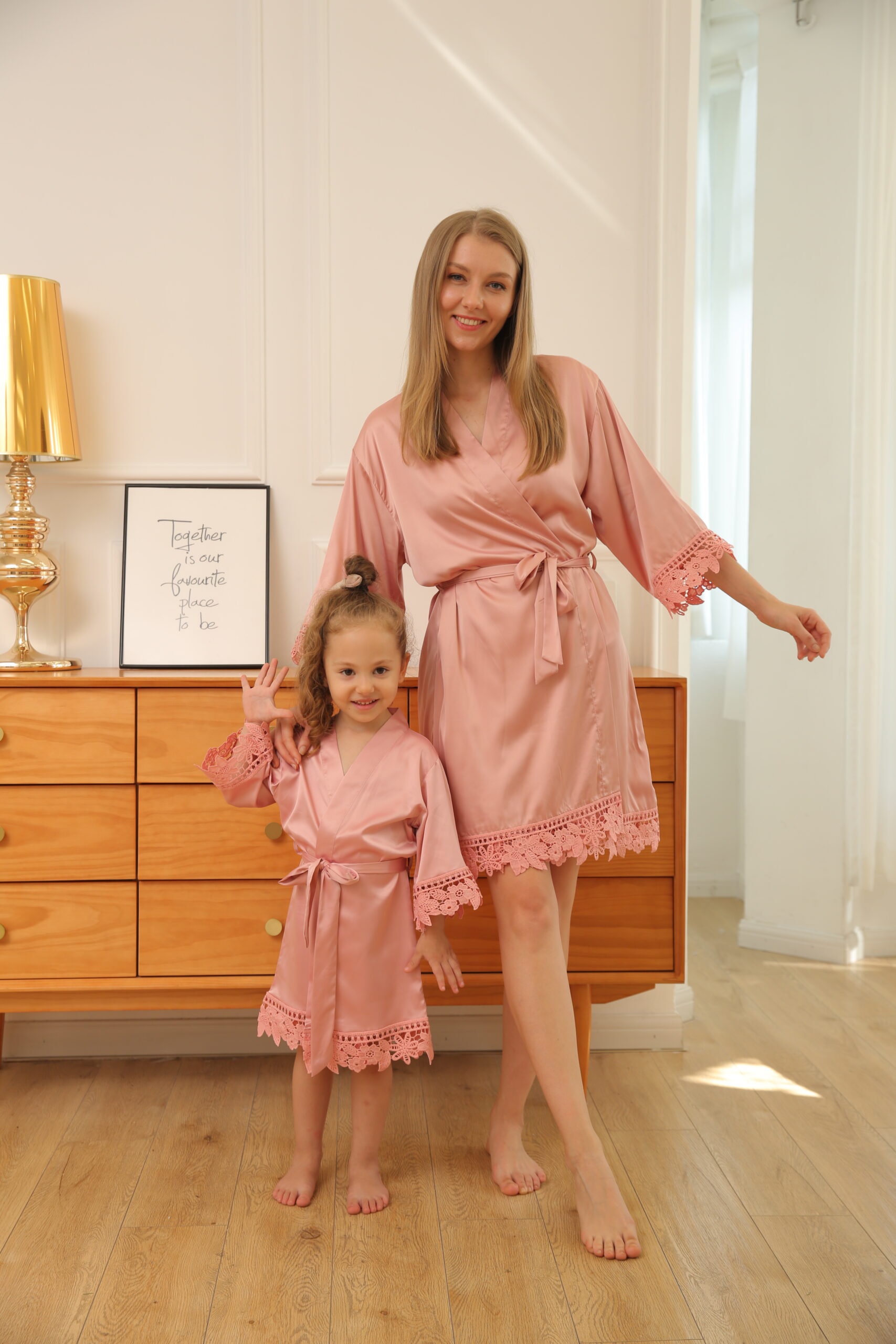 Mother and daughter wearing matching dusty rose pink satin lace robes – Children’s Personalised Satin Lace Robe from The Personalised Wedding Room