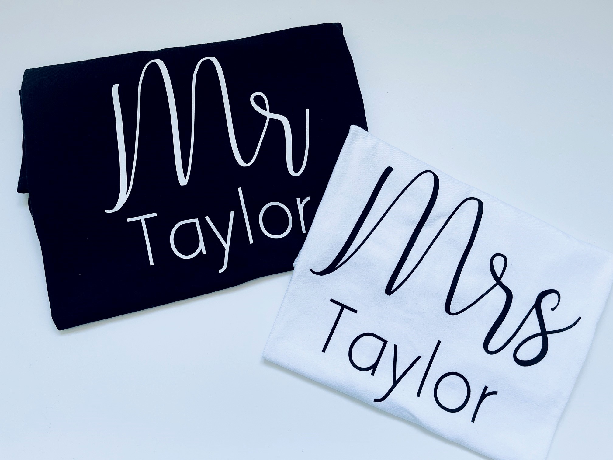 Bride wearing a white Personalised Mrs T-Shirt, customised with her name or date underneath—ideal for honeymoon or relaxed post-wedding moments.