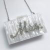 Pearl clutch bag with “Mrs” lettering, elegant bridal handbag for weddings, hen parties, honeymoons, and newlywed gifts.
