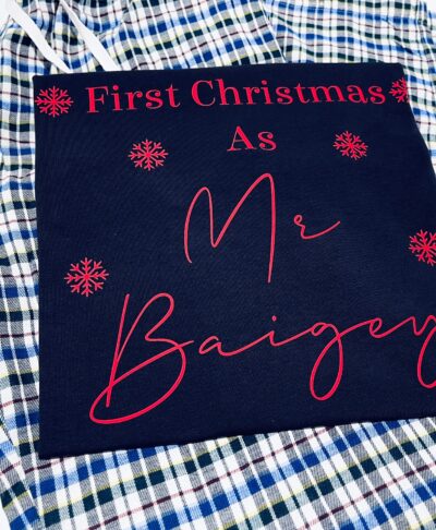 Personalised Christmas yajamas perfect for celebrating a First Christmas As Mr. and Mrs. The dark navy blue top, featuring the customised text 